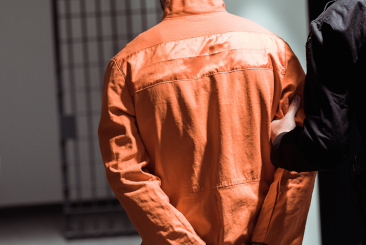 Prisoner walking in red jacket1